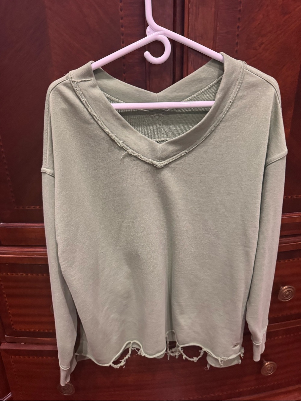Women's Washed Sage V-Neck Distressed Pullover Top